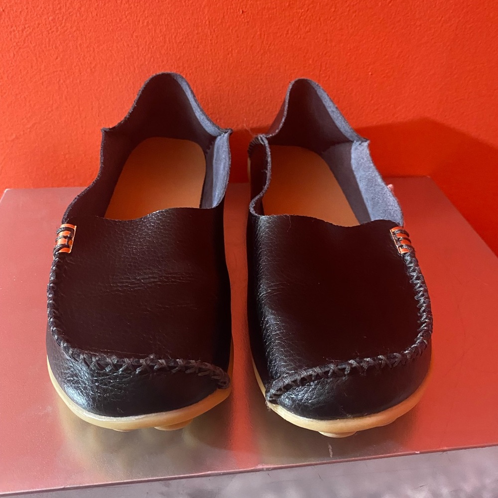 A Woman’s Black Slip On